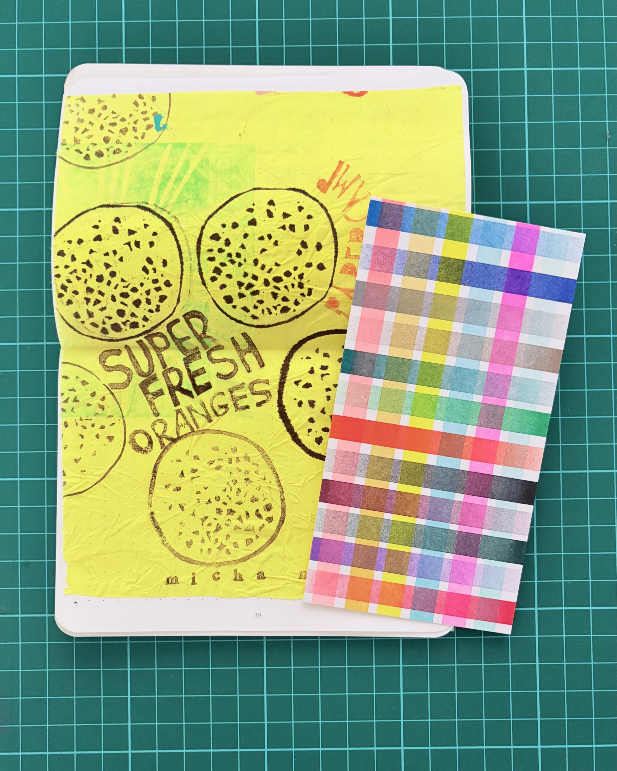 Hand printed orange wrapping paper or ‘citrus ephemera’, from Micha Nicheva and a riso printed bookmark from Antonia Stringer
